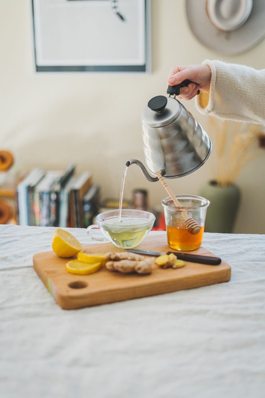 The Four Exhilarations Eat Well Ginger Honey Lemon Cutting Board Tea Cup Pouring minimalist aesthetic by Conscious by Chloé