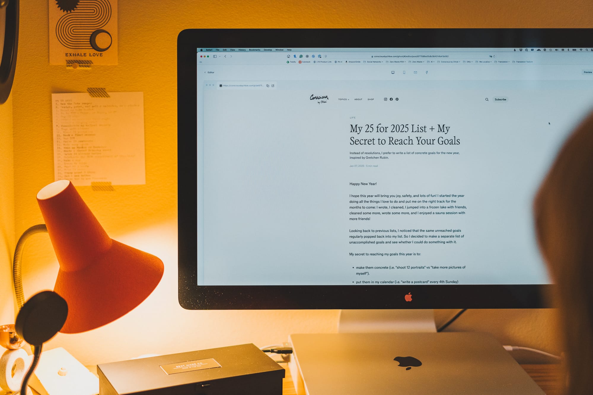 A person looking at their computer screen where an article titled "My 25 for 2025 List" is displayed